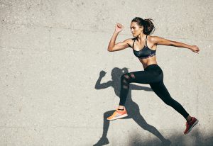 Woman running in clothes from DW Sports