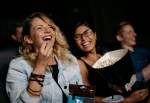 Woman eating popcorn in Odeon